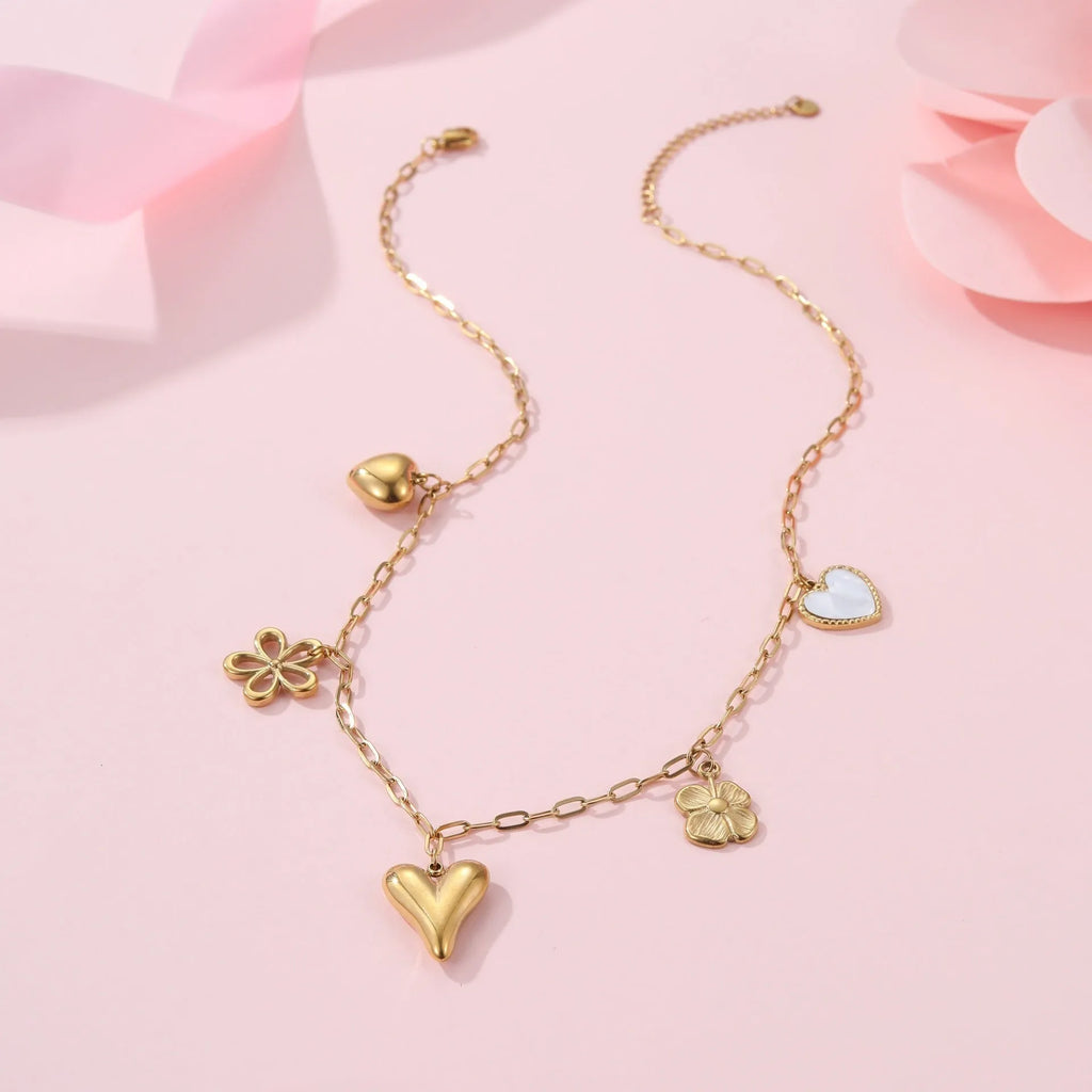 Stainless steel women's necklace with a sun pendant on a regular chain, showing heart and ribbon sun design options.