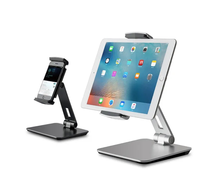 Black folding aluminium desktop stand holding a tablet at an angle, showing 360° rotation and silicone grips.