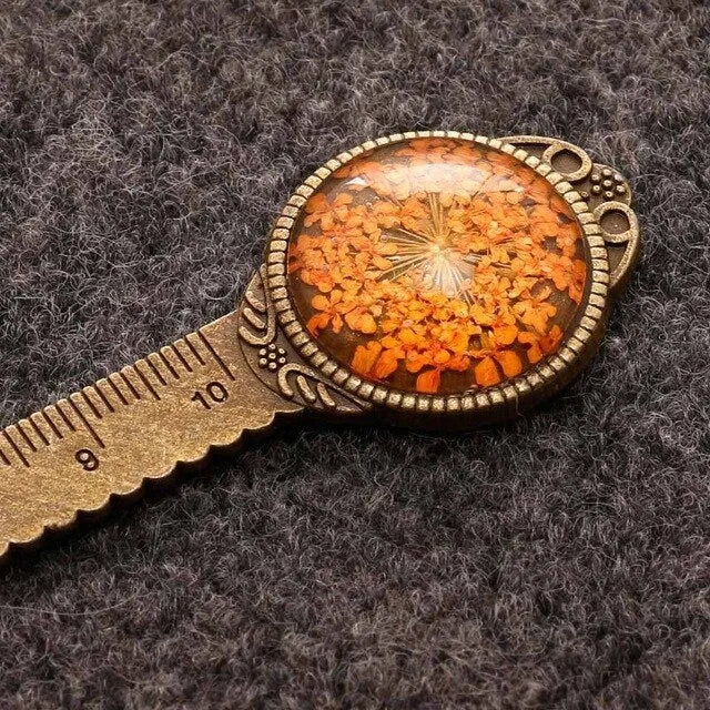 Handmade dried gypsophila flower bookmark ruler showing lace flowers, daffodils, and clovers on 12cm length