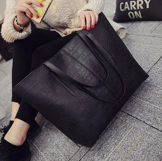 Simple fashion shoulder bag with crossbody strap in black or grey colour for spring and summer