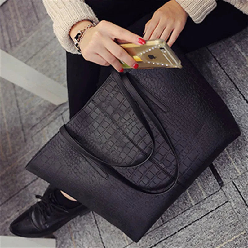Simple fashion shoulder bag with crossbody strap in black or grey colour for spring and summer