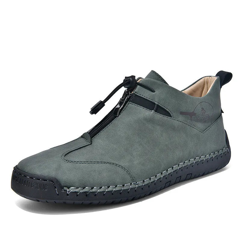 Casual men's leather shoe in green with round toe, mid heel, and decorative stitching