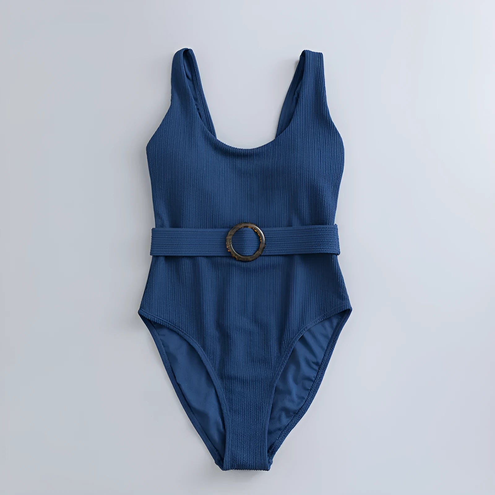 Navy blue one-piece women's swimsuit with triangle design and chest pads on a mannequin
