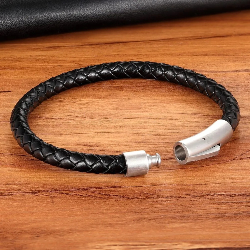 Black stainless steel bracelet with natural zircon stone on neutral background