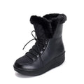 Black women's lace-up winter boots with a platform sole on a white background