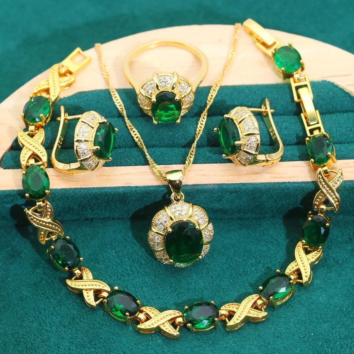 18k gold plated cubic zirconia jewellery set showing necklace, earrings, ring and bracelet in four colour options