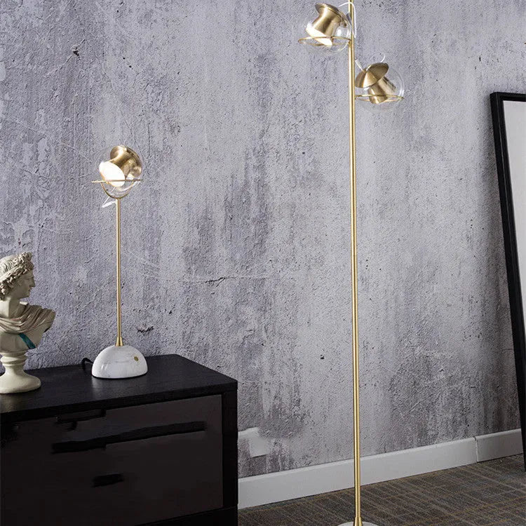 Modern desk lamp with a glass lampshade and touch-sensitive base for dimming control.