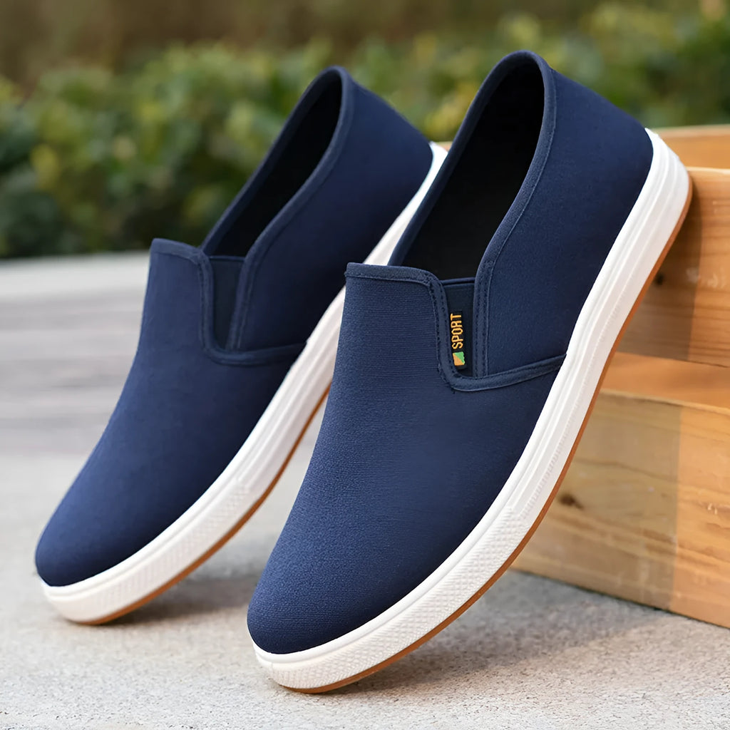 Men's black and blue canvas slip-on shoes with round toe and composite soles