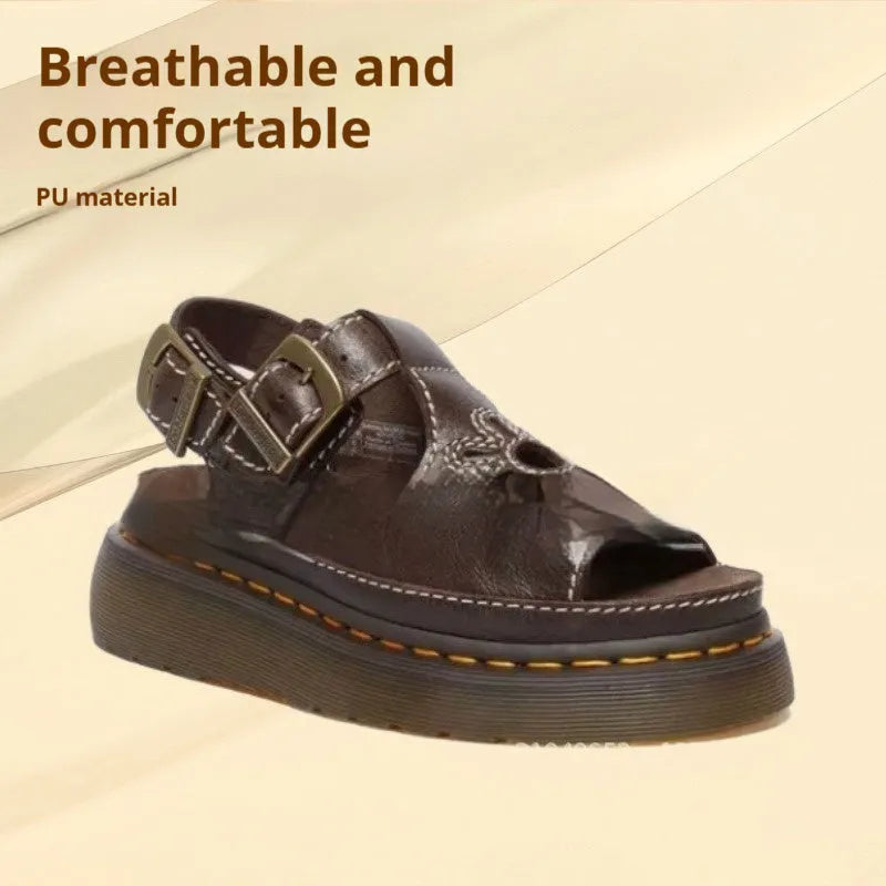 Men's black embroidered floral beach sandals with a flat heel on a plain background.