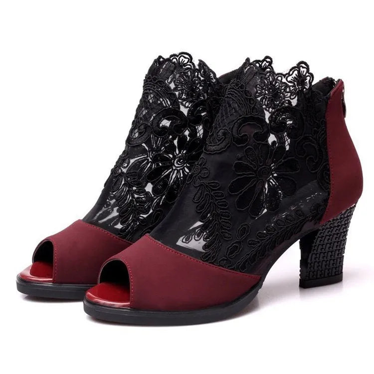 Women's black lace gladiator sandals with square heels and zip closure showing flower detailing