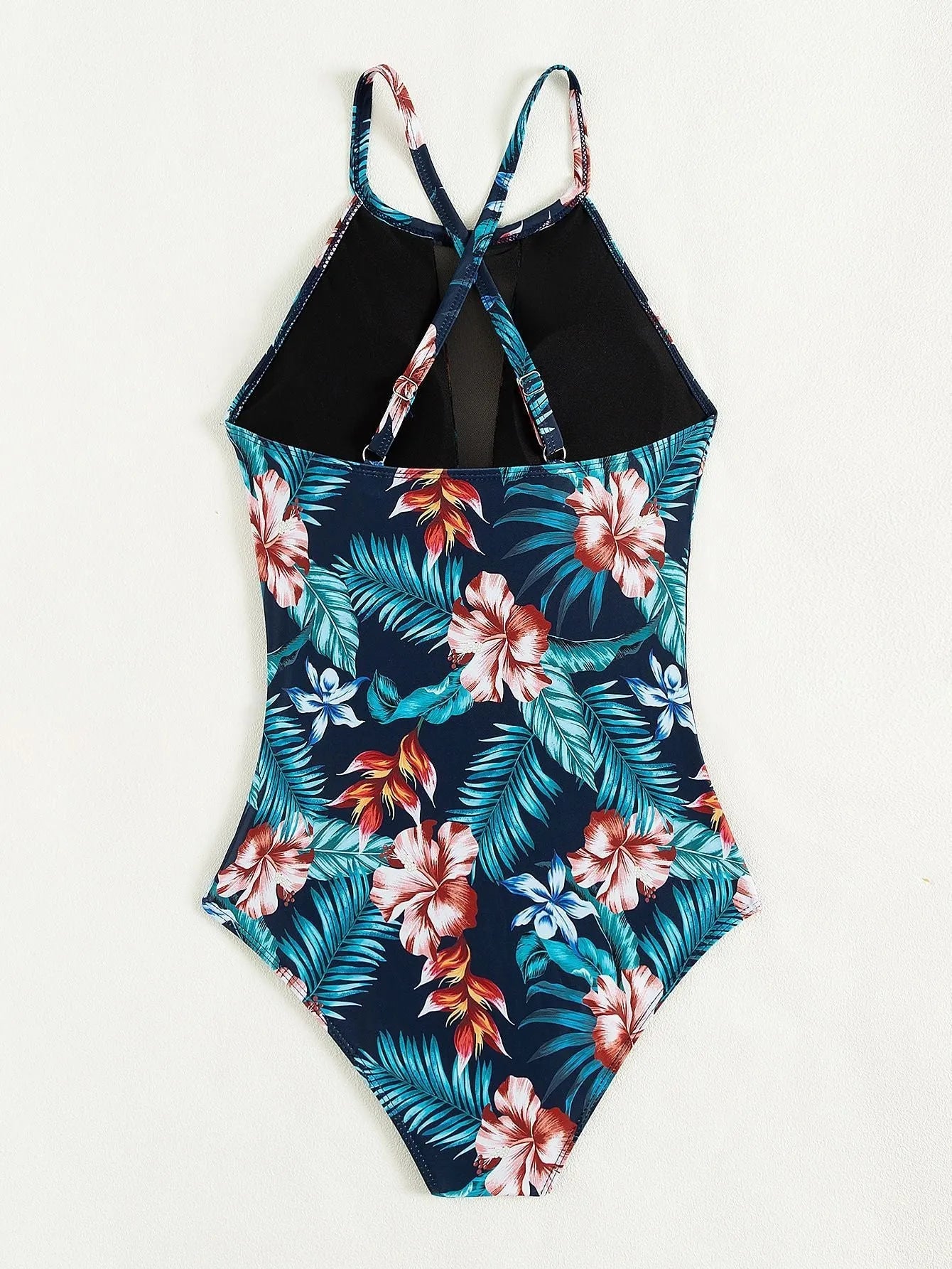Women's deep V-neck one-piece swimsuit in a printed pattern, shown in a solid colour option.