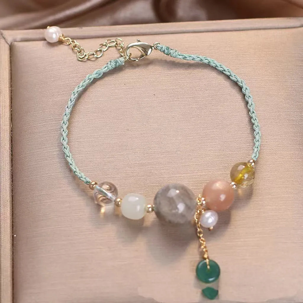 Hand-woven women's bracelet with peace buckle, crystal and sequin accents in red, green and blue colour options