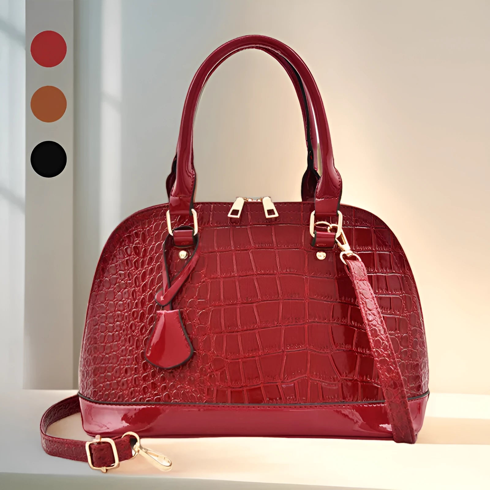 Large shiny black PU leather crossbody bag with shell shape, showing interior polyester lining and shoulder strap