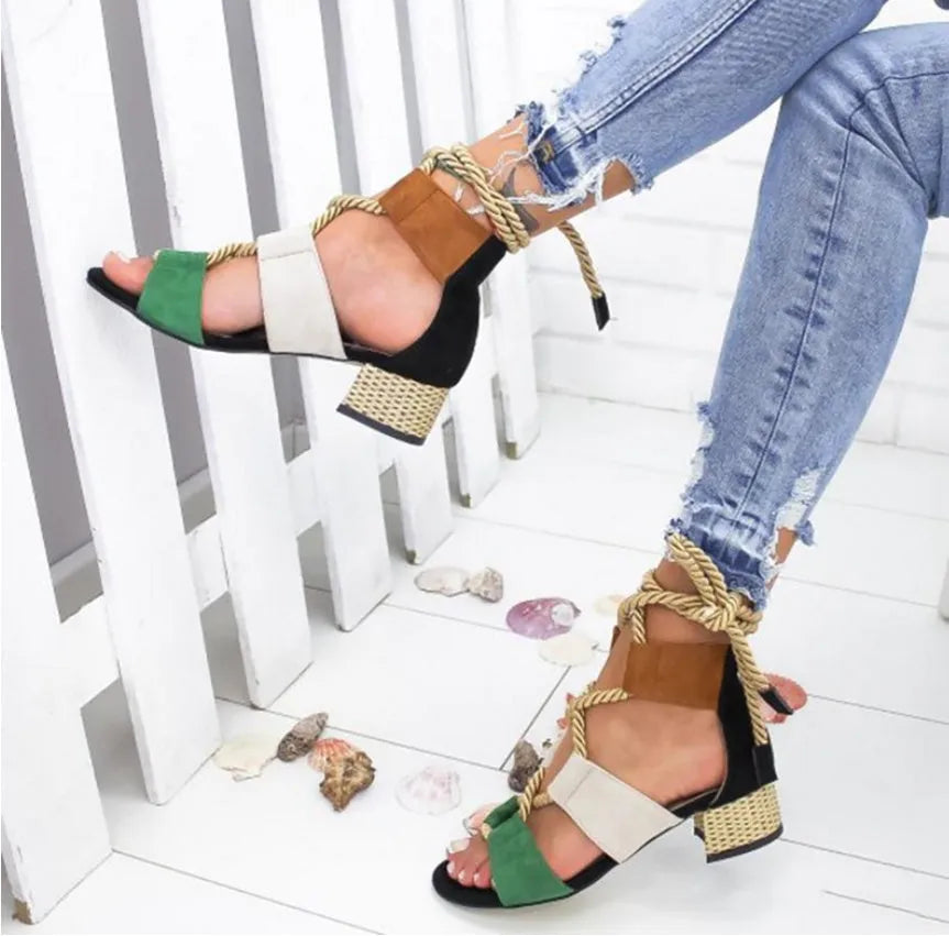 Women's beige suede sandals with a fish mouth toe, front strap, and ankle strap, featuring a thick middle heel.