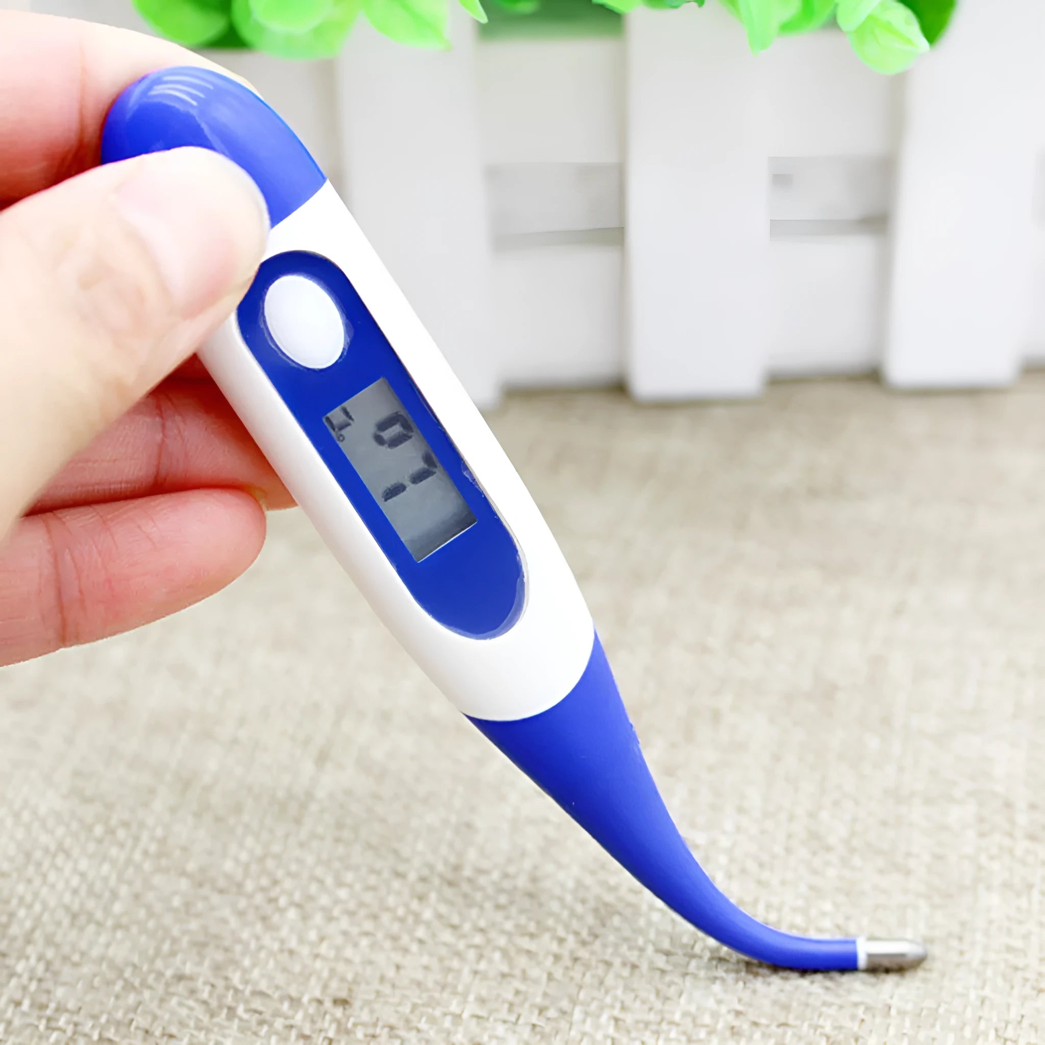 Blue digital electronic waterproof thermometer with LCD display, made from plastic and silicone
