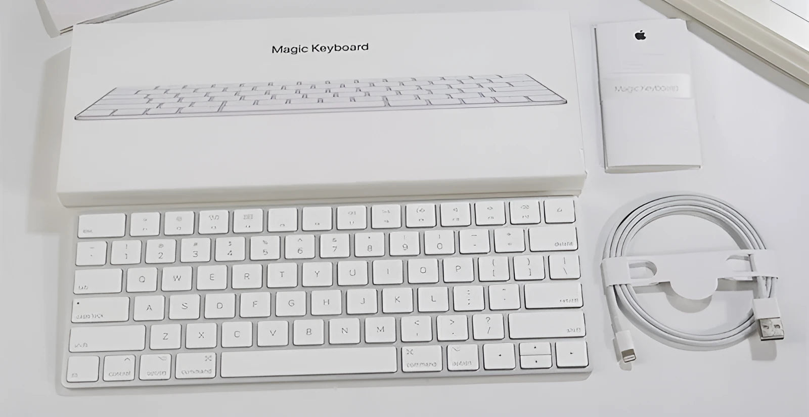 White Apple G6 Bluetooth keyboard with ultra-thin metal casing and multimedia keys