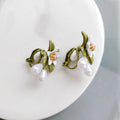 A pair of alloy flower earrings for women, shown in sterling silver needle flowers and flower ear clip styles.