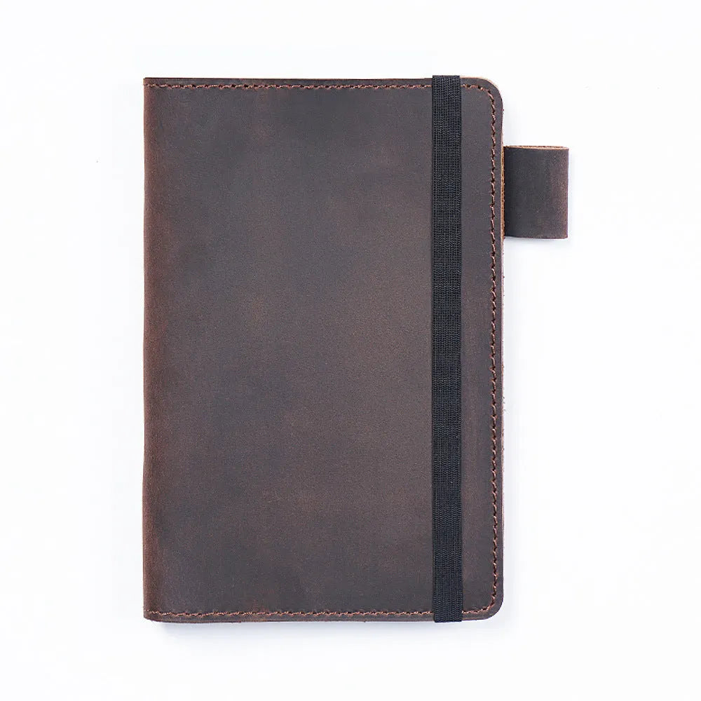 Handmade vintage Kraft notebook with cowhide cover in dark green, open to show wood-free paper pages