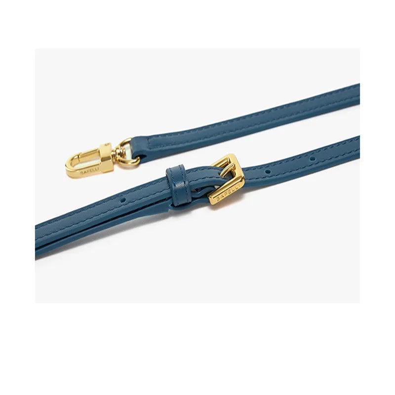 Wing-shaped women's leather handbag with latch closure and cross-body strap in available colours.