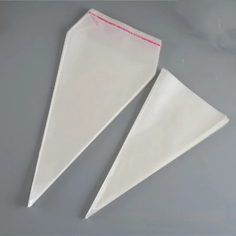 Clear triangle-shaped plastic packaging bag with a twisted wire tie closure on a white background.