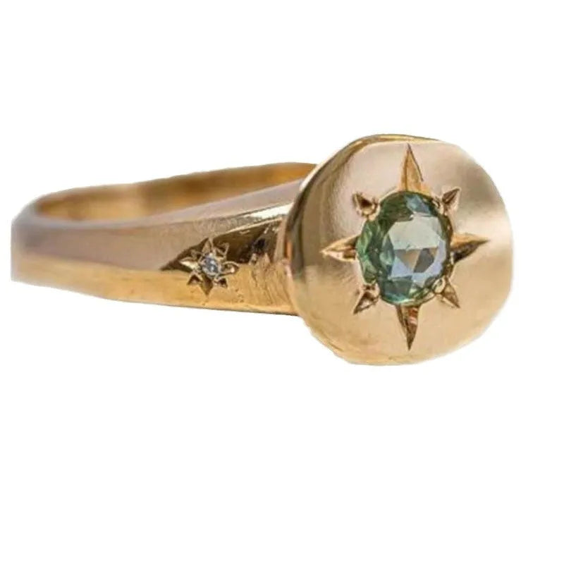 Gold-coloured adjustable ring featuring an oval star shape with a zircon stone.