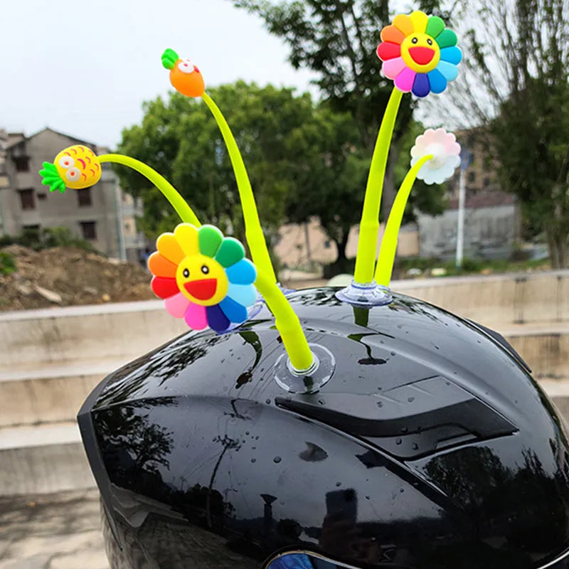 Silicone swinging sunflower decoration with suction cup for motorcycle and bicycle helmets.