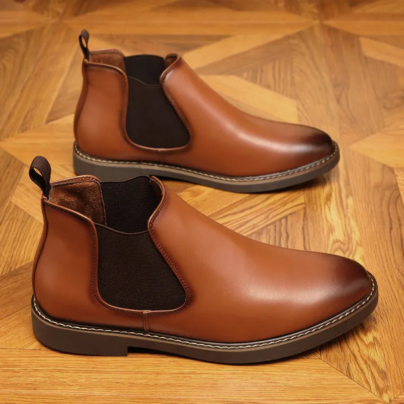 A pair of black formal pointed-toe leather boots with a square heel and rubber sole.