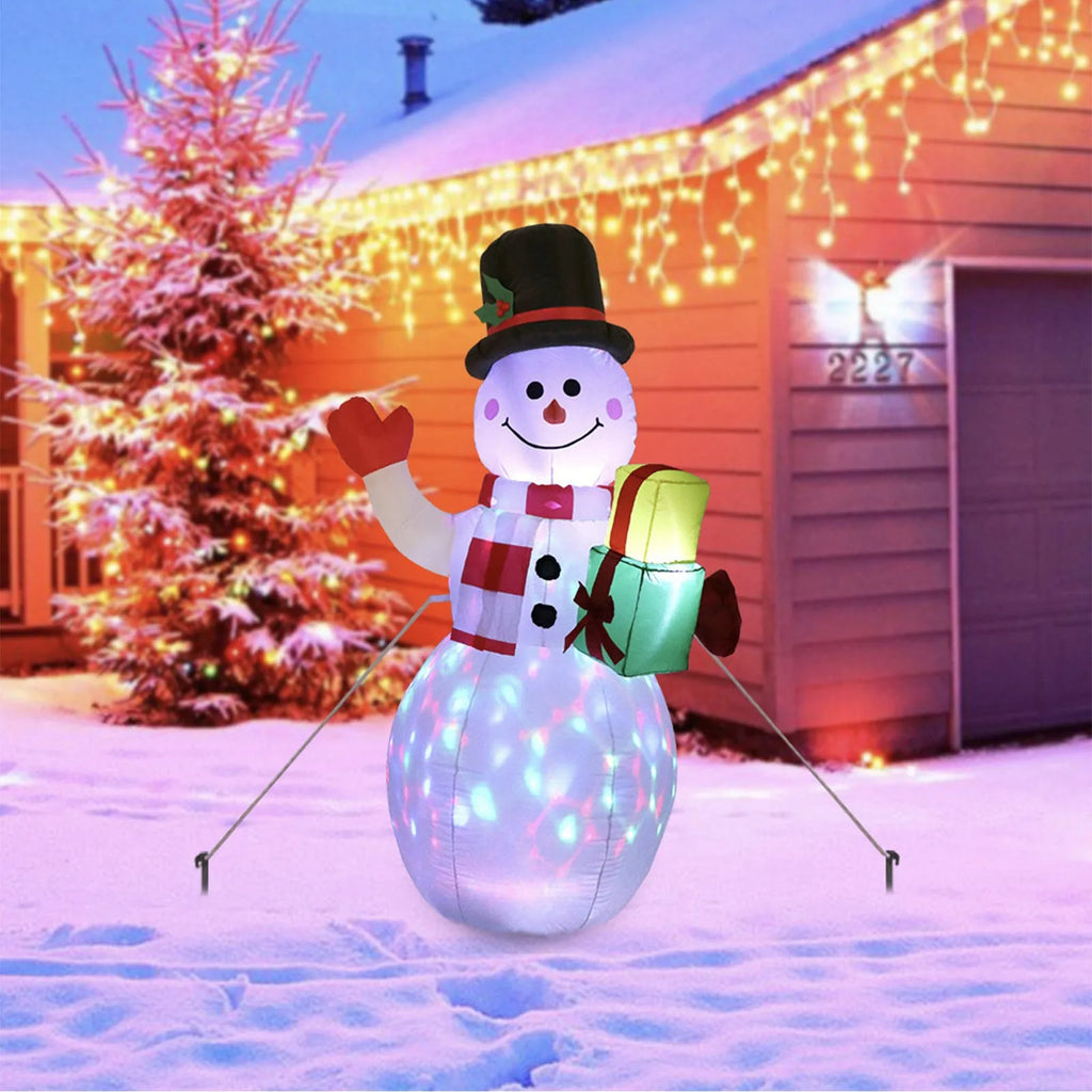 Christmas LED inflatable decoration of a glowing Santa Claus figure in a garden at night
