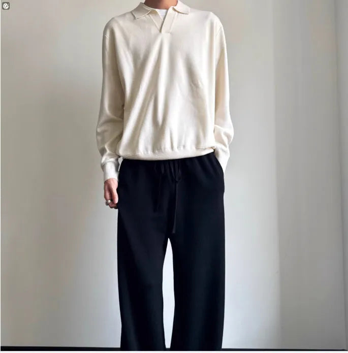 Pure wool polo neck sweater with lapel collar in loose fit, shown in milky white.