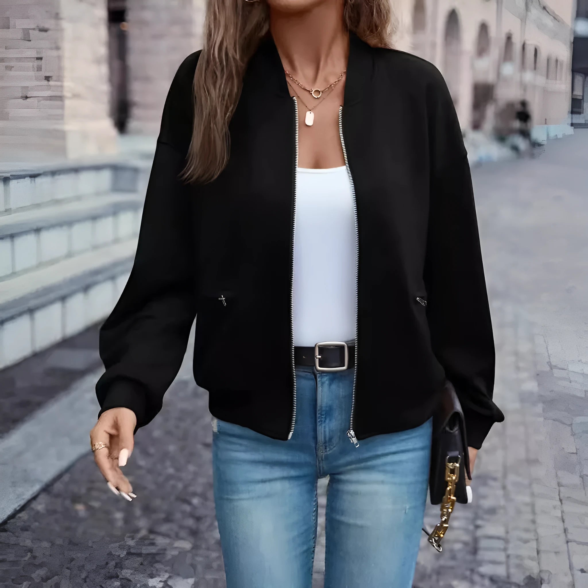 Black women's casual zip-up jacket with long sleeves and faux pockets on the front.