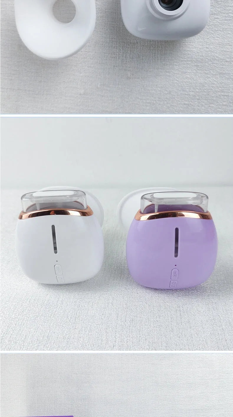 White and purple household eye humidifier moisturising instrument with rechargeable lithium battery.