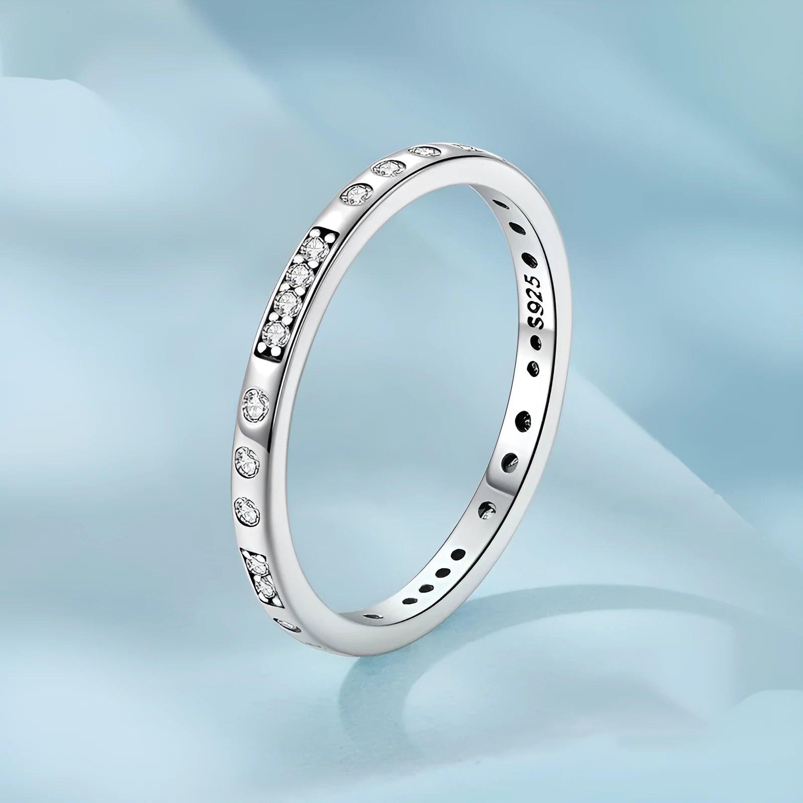 Moss Password I Love You silver ring with oxidised black finish on a model's finger, showing simple bracelet style.