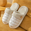 Plaid-patterned detachable women's slippers with plush lining and a textured EVA sole.