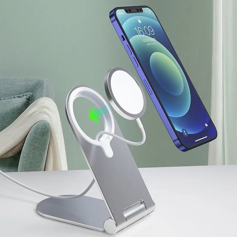 Silver vertical adjustable portable magnetic phone bracket on a metallic surface