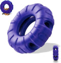 Blue natural rubber tyre-shaped dog chew toy and slow feeder with six oval openings.