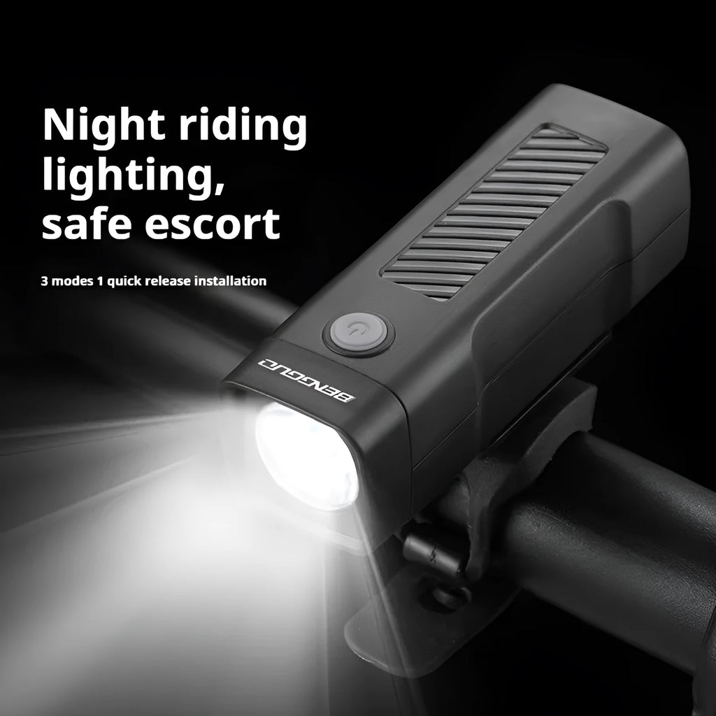 USB rechargeable bicycle headlight mounted on handlebars with quick release strap bracket