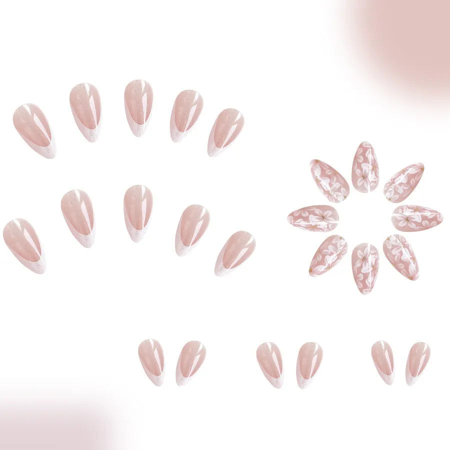 Removable short almond nails with French style finish and glitter flower decoration in colour C625
