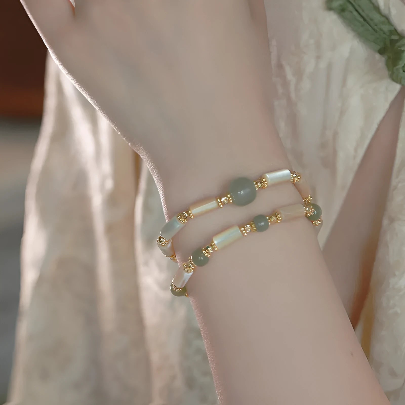 Handmade Hetian jade white lip shell bracelet with round beads on wrist
