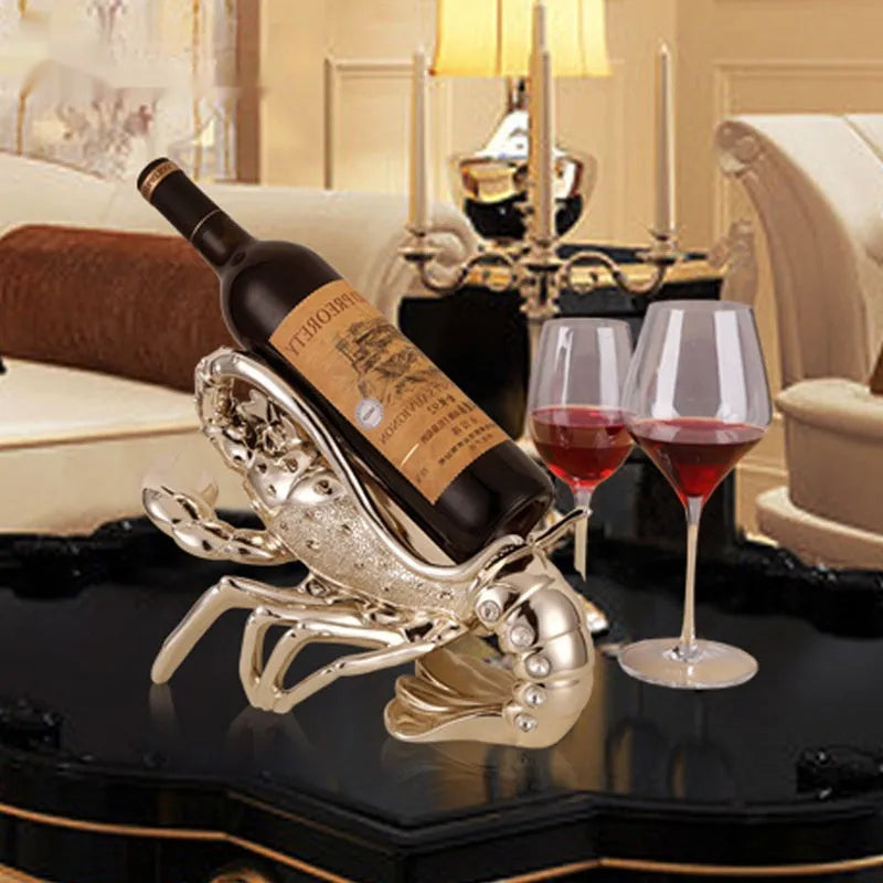 Lobster-shaped wine rack ornament in metallic rose gold or silver finish displaying wine bottle