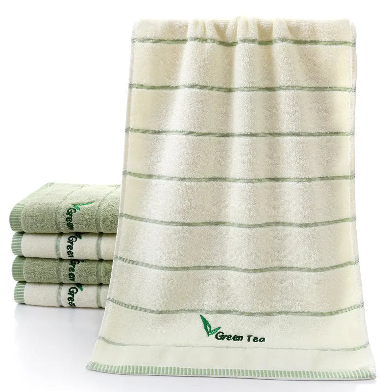 Pure cotton 32 strand embroidered face washing towel in green, 34x74 cm, on white background