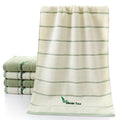Pure cotton 32 strand embroidered face washing towel in green, 34x74 cm, on white background