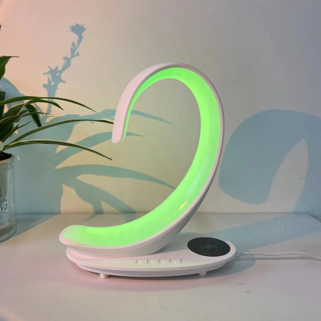 White swan-shaped desktop wireless charger Bluetooth speaker with colourful LED atmosphere lighting