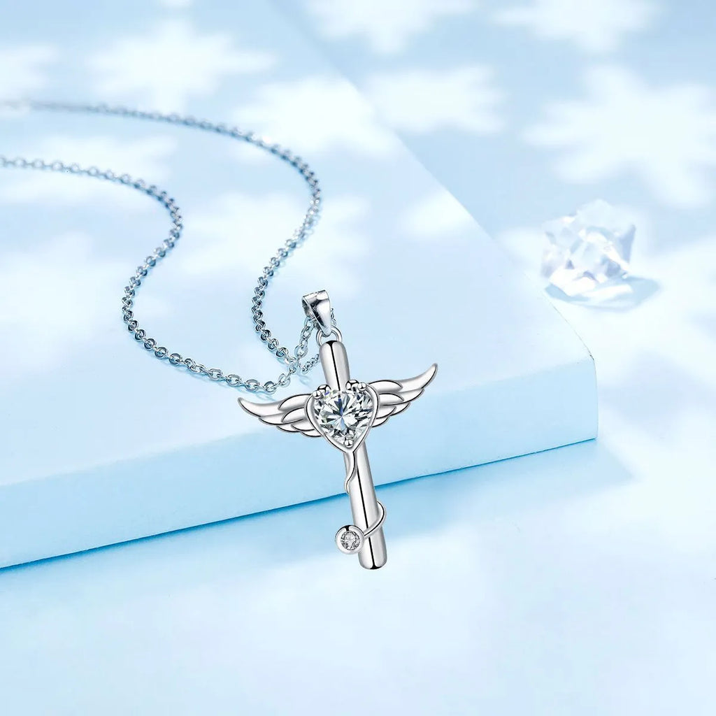 Stethoscope-shaped copper necklace with wing design elements in electroplated red or white diamond finish