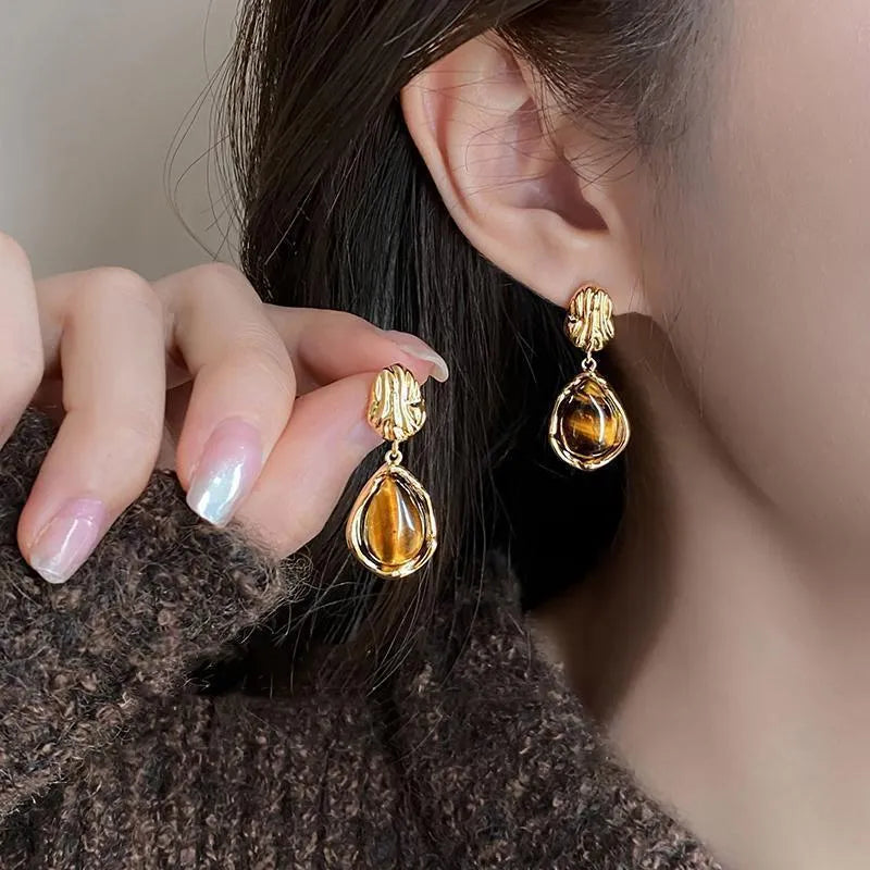 Handmade geometric alloy earrings with tassels in three styles: round, irregular, and teardrop