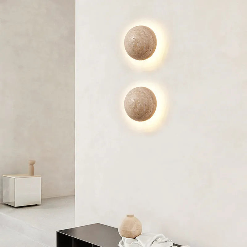 Vintage semicircle wall lamp with yellow cave stone shade and iron base, showing pull switch.