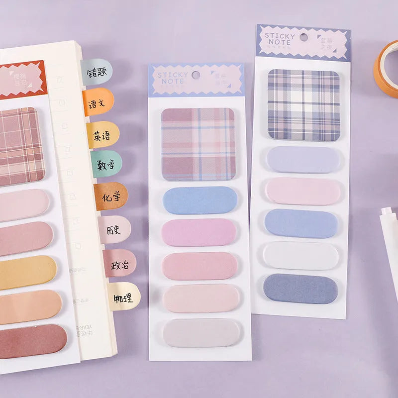 Colourful sticky notes memo pad showing six different designs with plaid and solid colours