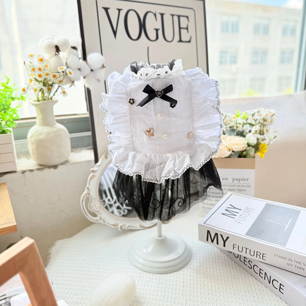 White polyester princess-style waltz gauze skirt for a small dog on a hanger.
