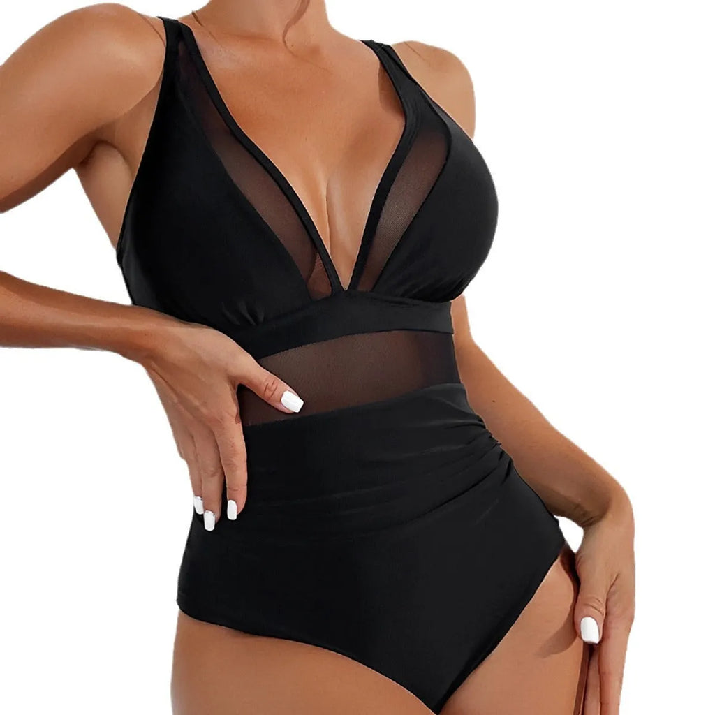 Black women's halter neck one-piece swimsuit with mesh panels on mannequin