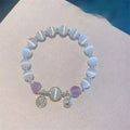 Women's manually crafted glass butterfly bracelet in drop shape with round elements