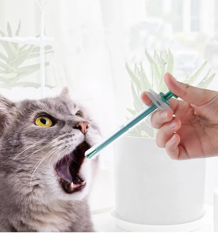 Two pet pill shooter syringes with soft silicone tips for administering medication to cats and dogs